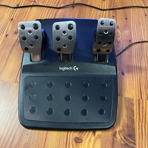 Logitech steering wheel and pedals for PlayStation.